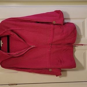 Bright pink tie waist sweater.